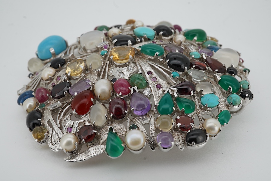 A large recent white metal (stamped 92.5) and multi gen set circular brooch, 89mm.